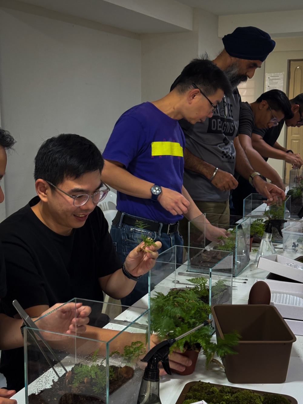 A group building terrariums together